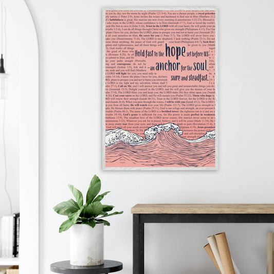 pink framed christian artwork with waves and anchor and scripture text displayed in a bright minimalist home office