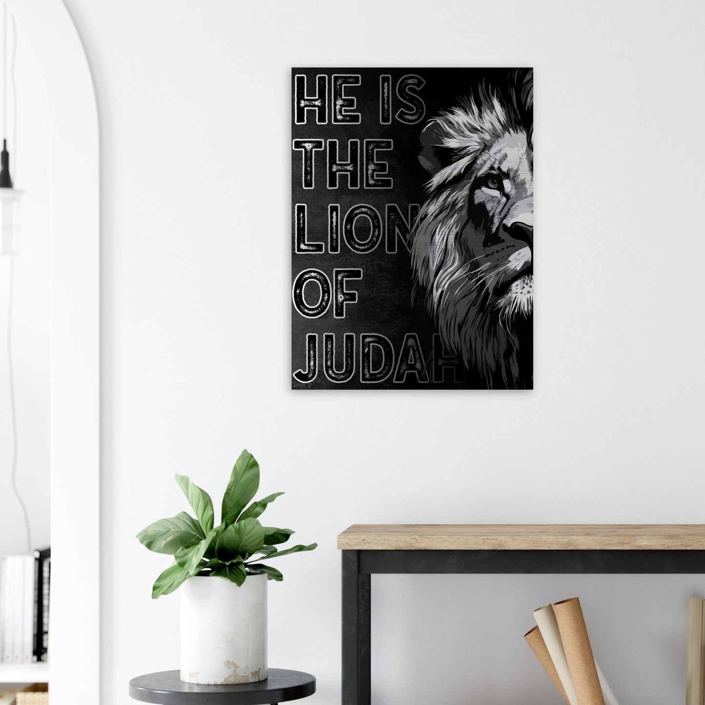 Black and white Lion of Judah Christian wall art featuring a bold lion illustration and lettering, displayed in a bright modern room with minimalist décor.