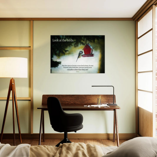Modern bedroom with a desk, chair, and wall art featuring a birdhouse and text.