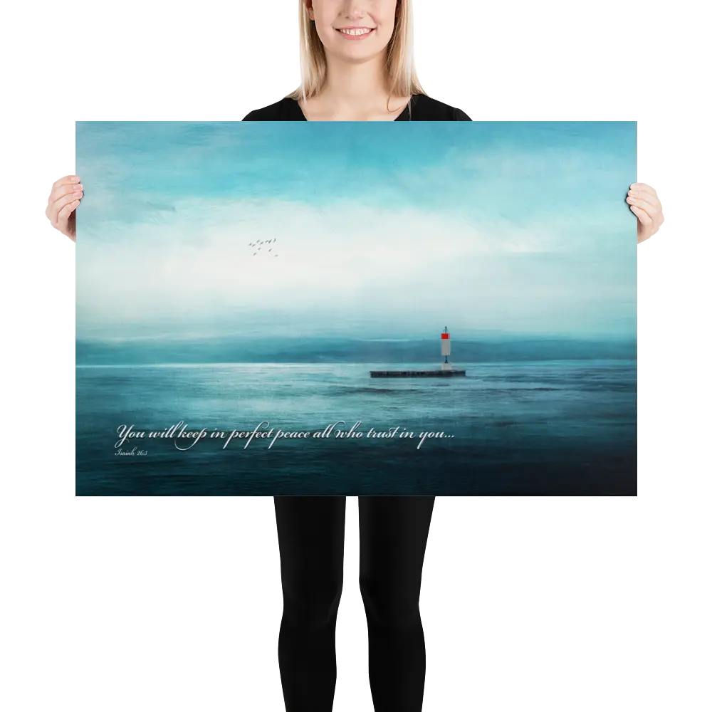Person holding a large poster of a lighthouse over water with a quote.