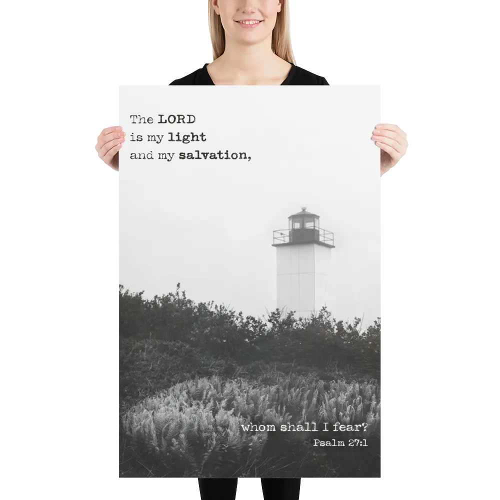 Person holding a poster with a lighthouse and religious text.