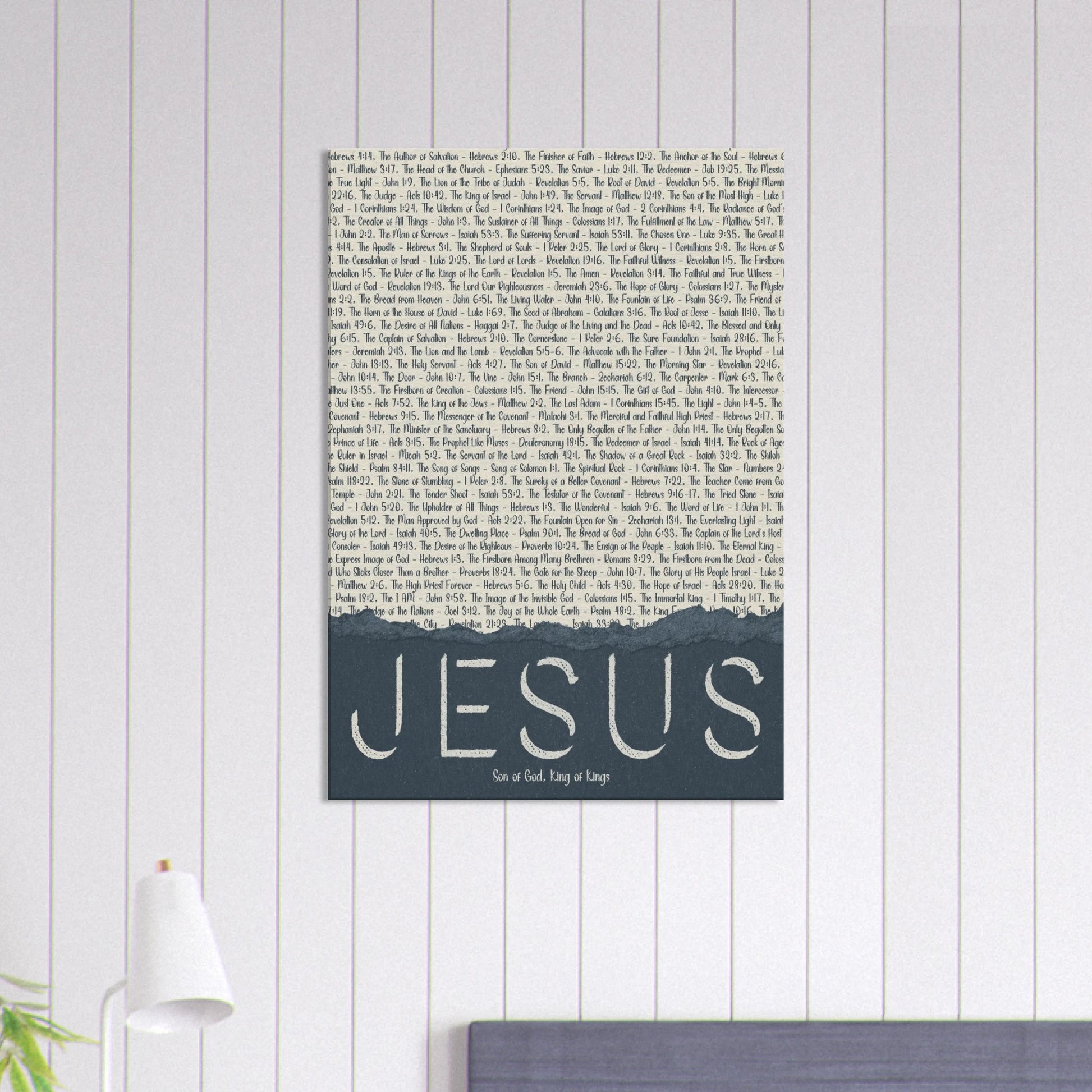 Wall art with 'Jesus' text on a light wooden panel background