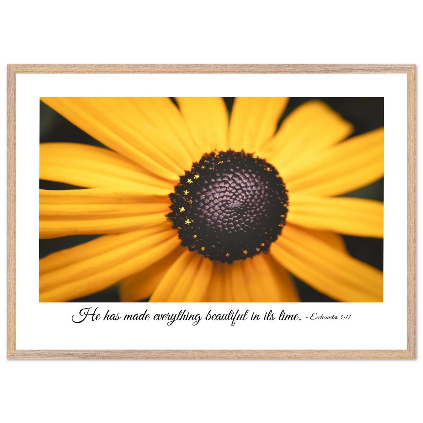 A framed art print of a close-up yellow flower with a quote from Ecclesiastes 3:11, 'He has made everything beautiful in its time.'.