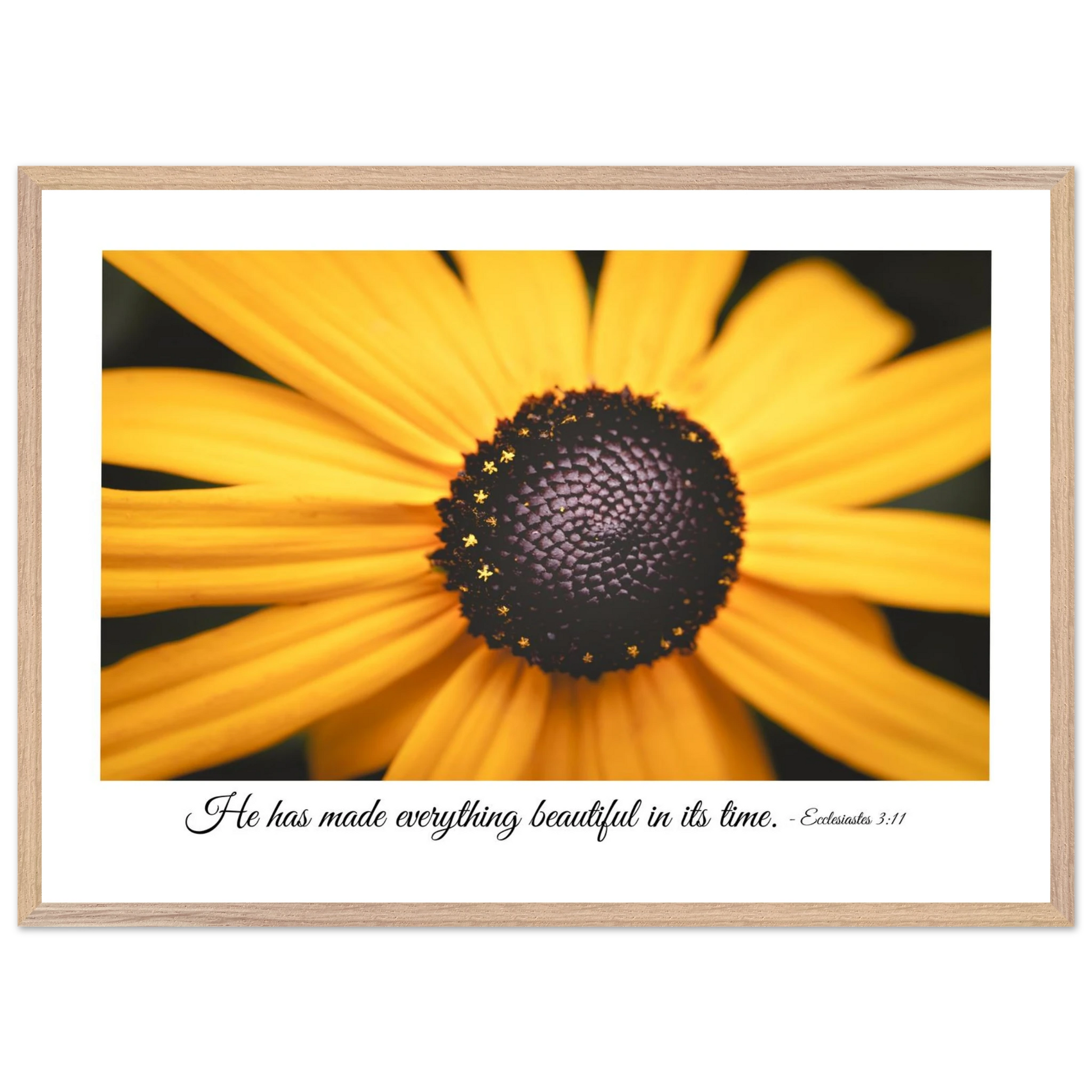 A framed art print of a close-up yellow flower with a quote from Ecclesiastes 3:11, 'He has made everything beautiful in its time.'.