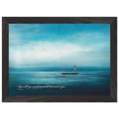 A framed poster featuring a lighthouse in a serene seascape with the text 'You will keep in perfect peace all who trust in you.' from Isaiah 26:3.