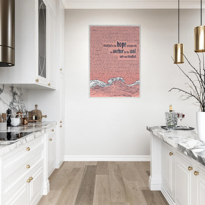 pink framed christian artwork featuring waves and anchor with scripture text displayed in a modern white kitchen