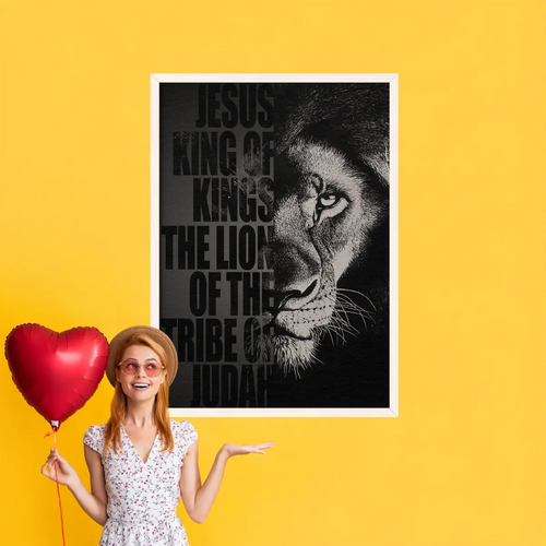 Woman holding a heart-shaped balloon next to a framed poster of a lion's face with text on a yellow background