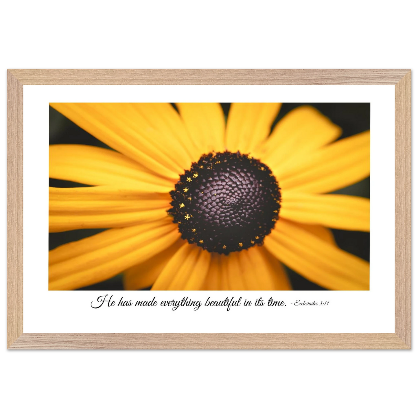 A framed art print of a close-up yellow flower with a quote from Ecclesiastes 3:11, 'He has made everything beautiful in its time.'.