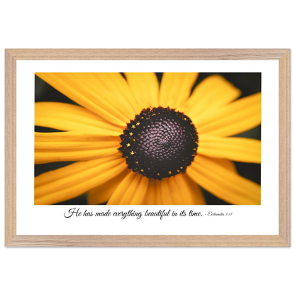 A framed art print of a close-up yellow flower with a quote from Ecclesiastes 3:11, 'He has made everything beautiful in its time.'.