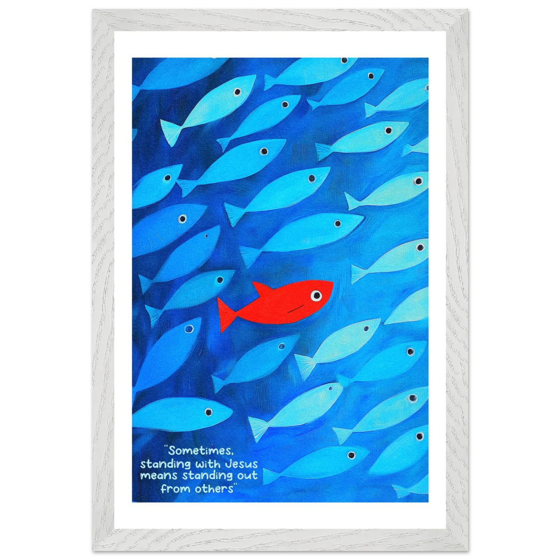 Framed wall art featuring a school of blue fish with a single red fish, and text that reads: 'Sometimes standing with Jesus means standing out from others.'.