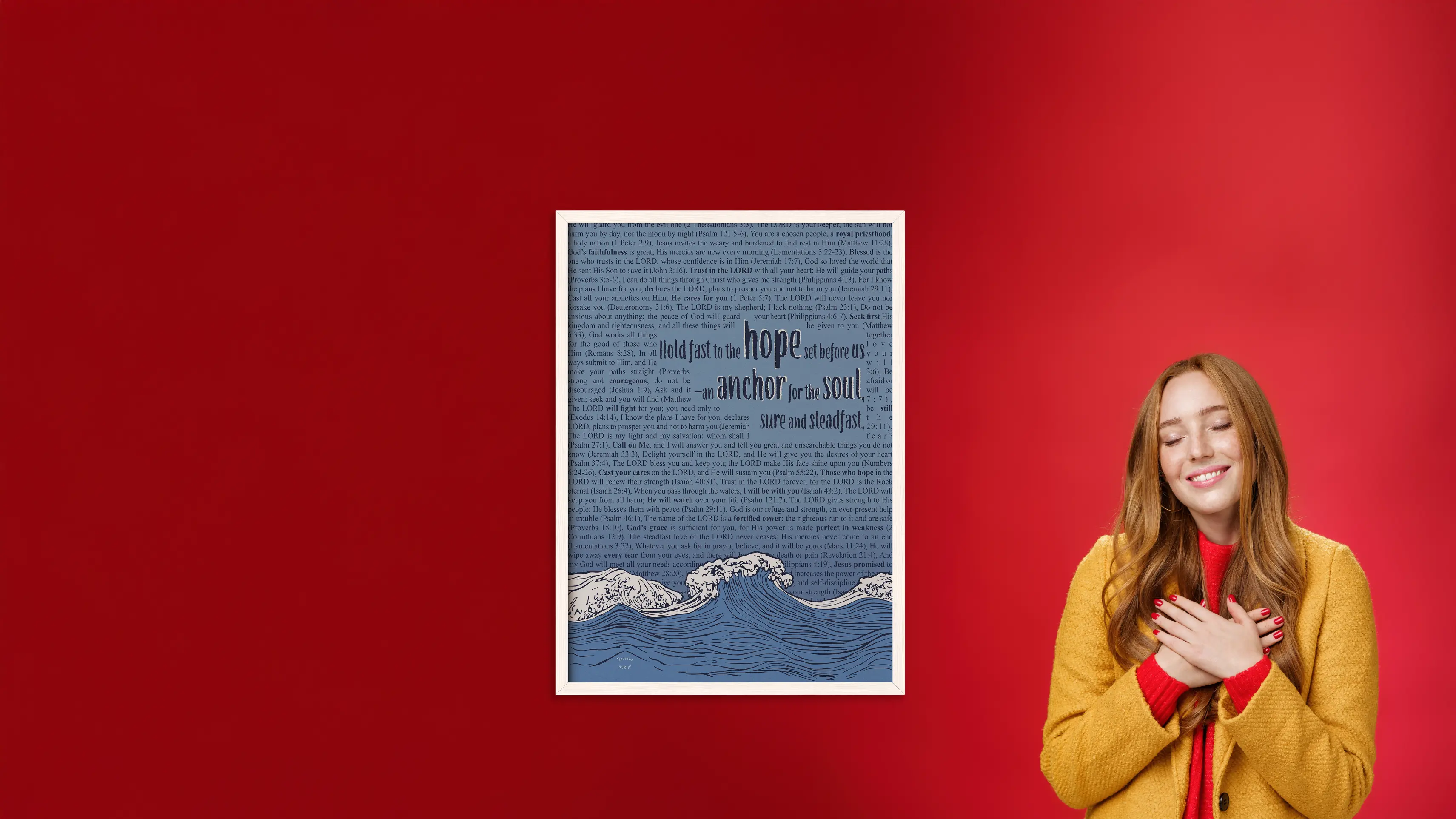 Woman standing next to a framed artwork on a red background