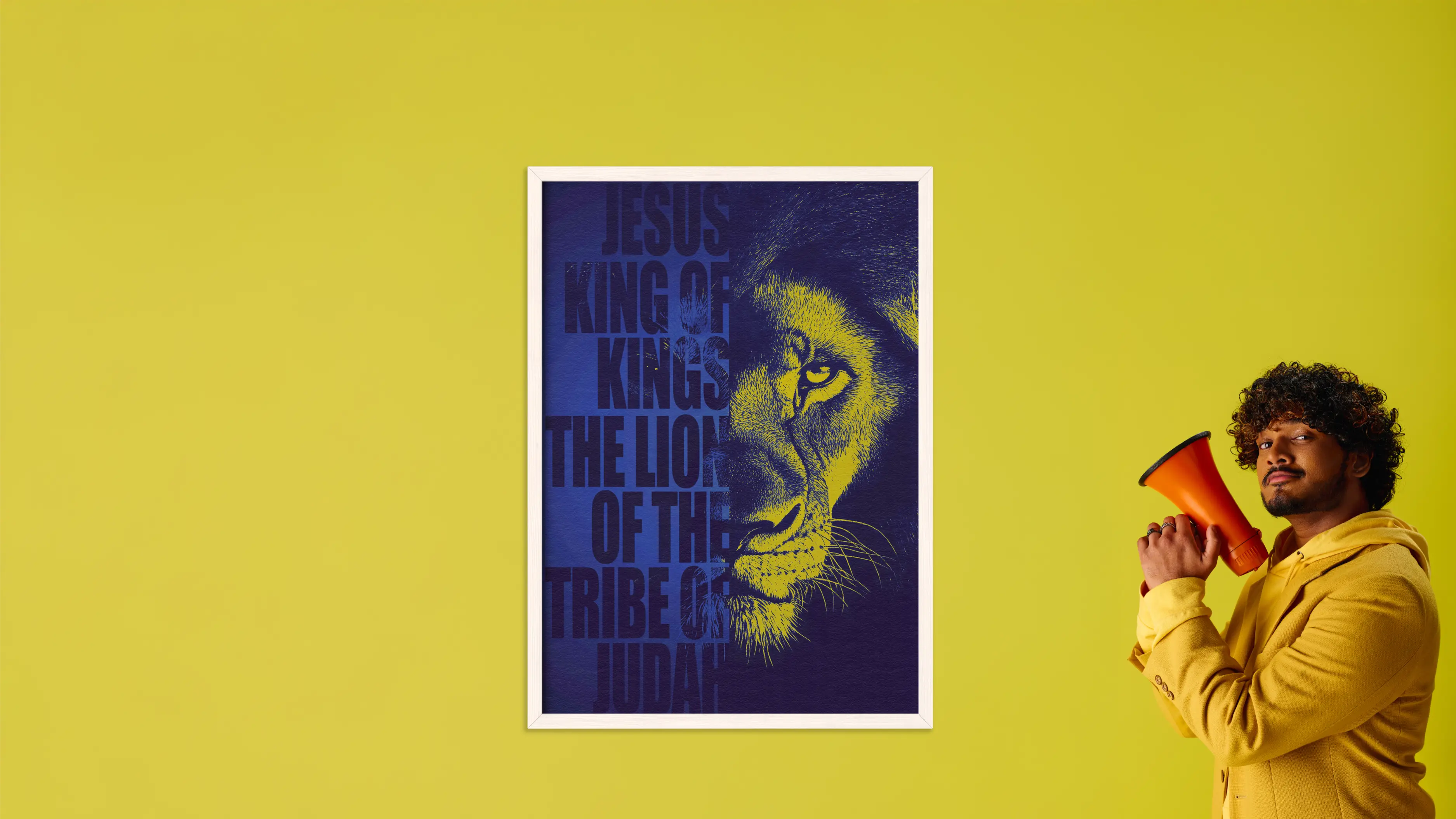 Person holding a megaphone in front of a framed picture of a lion with text on a yellow background