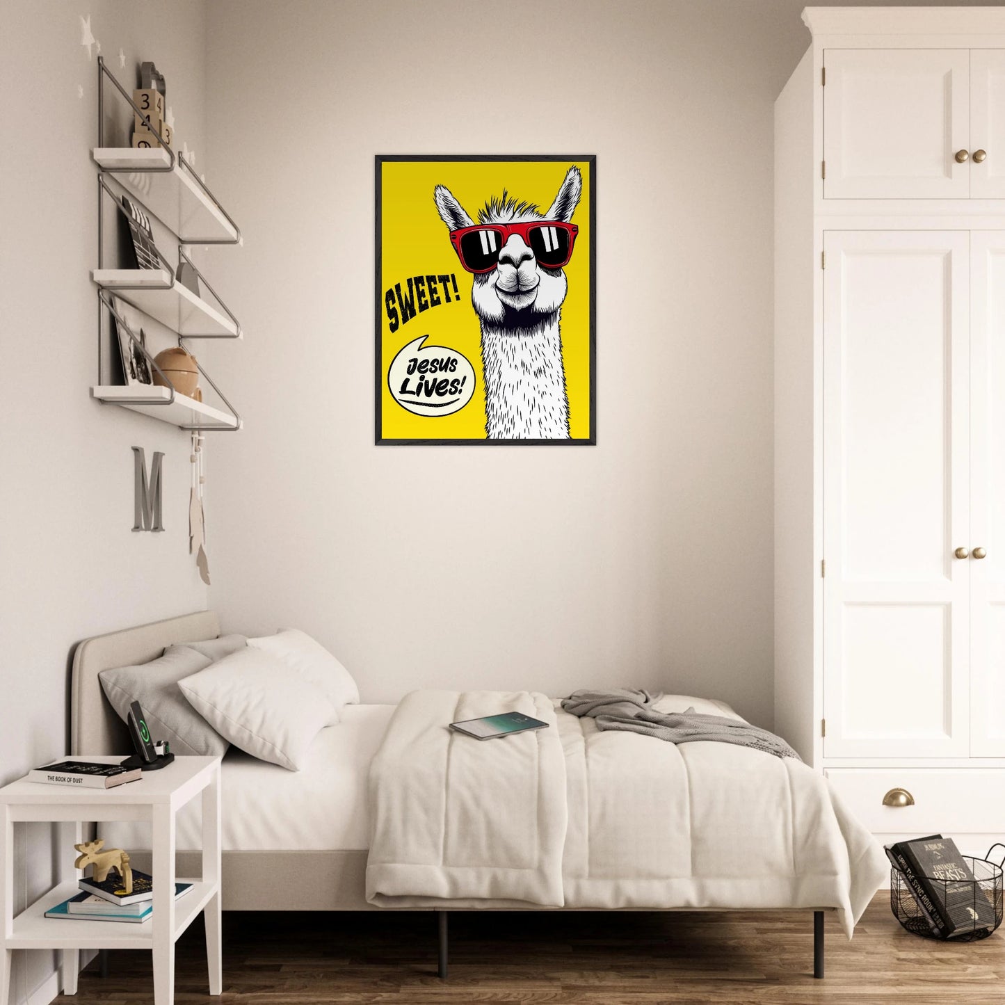 Framed Christian wall art featuring a white llama wearing red sunglasses on a bright yellow background with playful text reading SWEET and Jesus Lives, displayed above a neatly made bed in a modern bedroom.