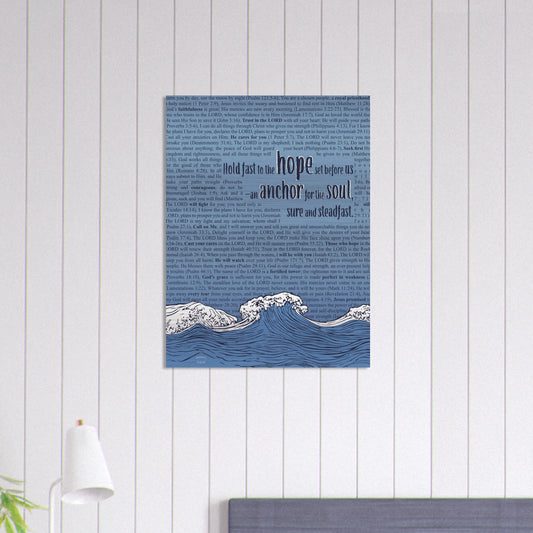 wave and anchor metal print with scripture text in pink and silver displayed on a white shiplap wall in a bright coastal-style room
