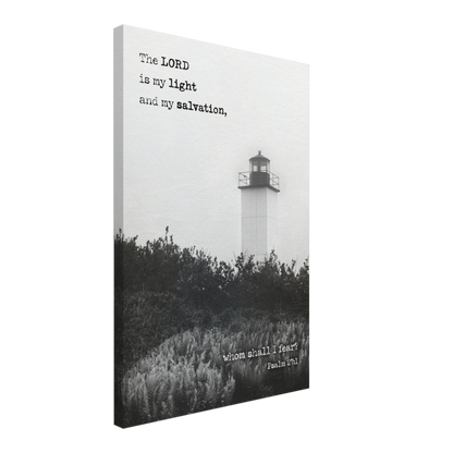 A canvas wall art print featuring a lighthouse with a black and white coastal landscape and the text of Psalm 27:1 which reads 'The Lord is my light and my salvation.'.