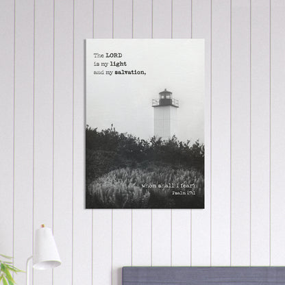 Psalm 27:1 lighthouse Christian wall art displayed in a bedroom on a light gray vertical-paneled wall.