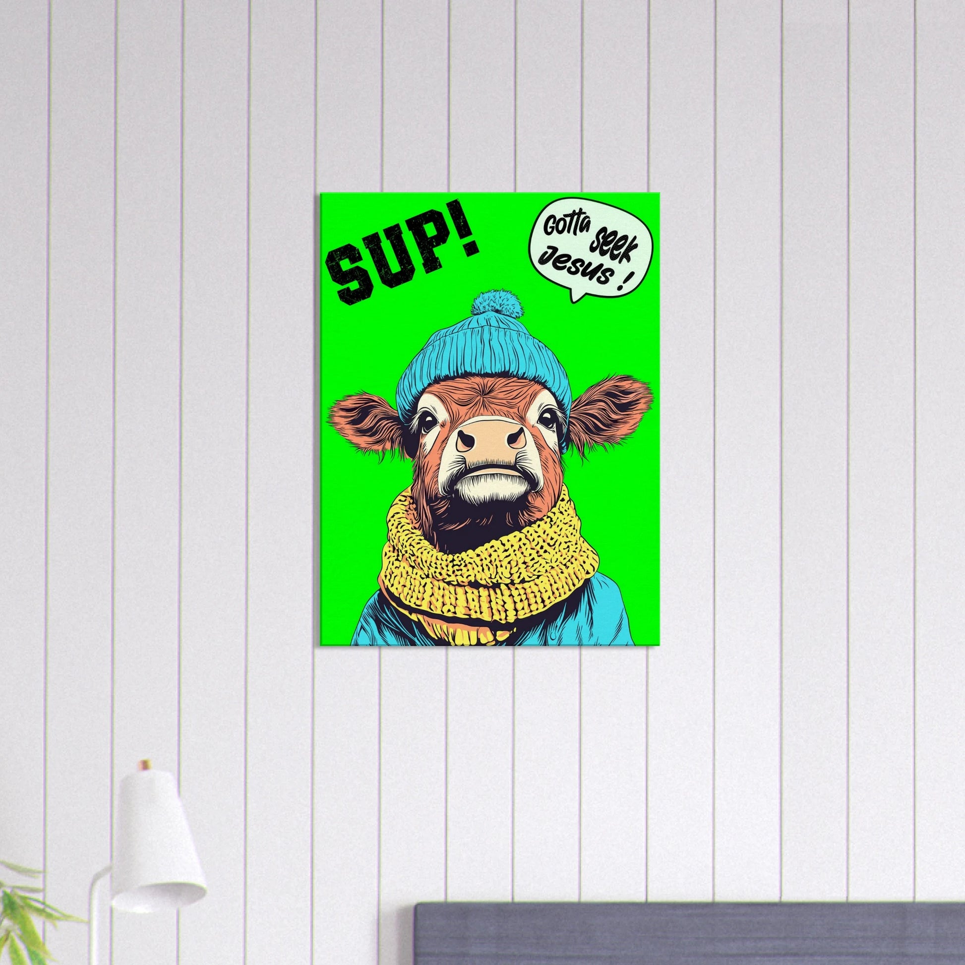 A vibrant green canvas featuring a cartoon style Highland cow with a beanie hat and a scarf, holding a sign with the text 'Gotta Seek Jesus' displayed in a bright minimalist room with small lamp decor