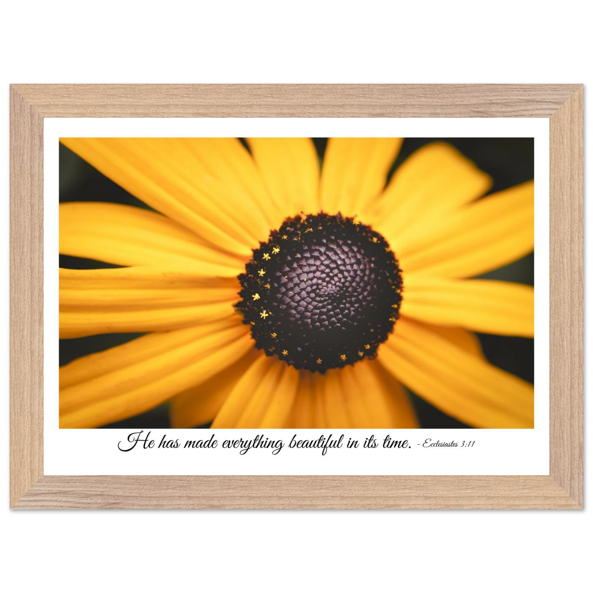 A framed art print of a close-up yellow flower with a quote from Ecclesiastes 3:11, 'He has made everything beautiful in its time.'.