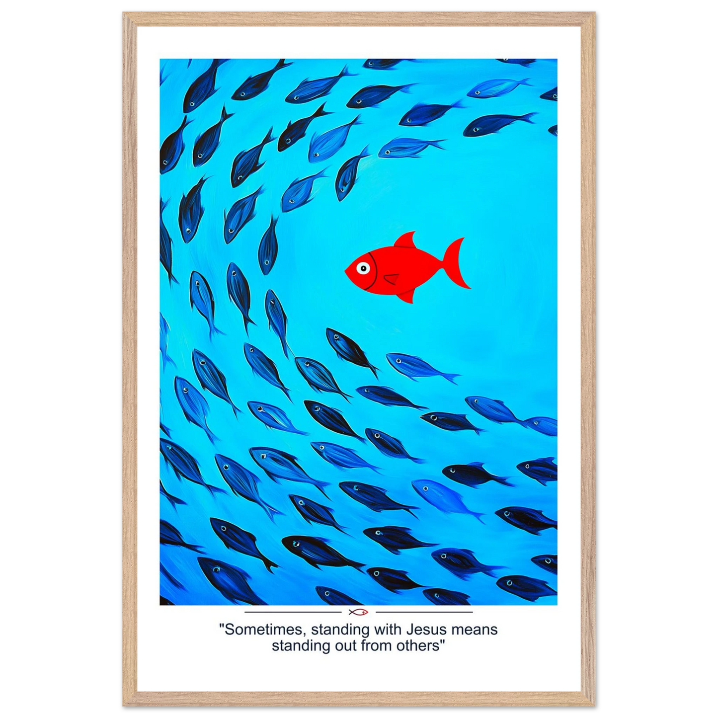 Framed Christian wall art featuring a red fish swimming in water with blue fish, and the text 'Sometimes standing with Jesus means standing out from others' as a quote.