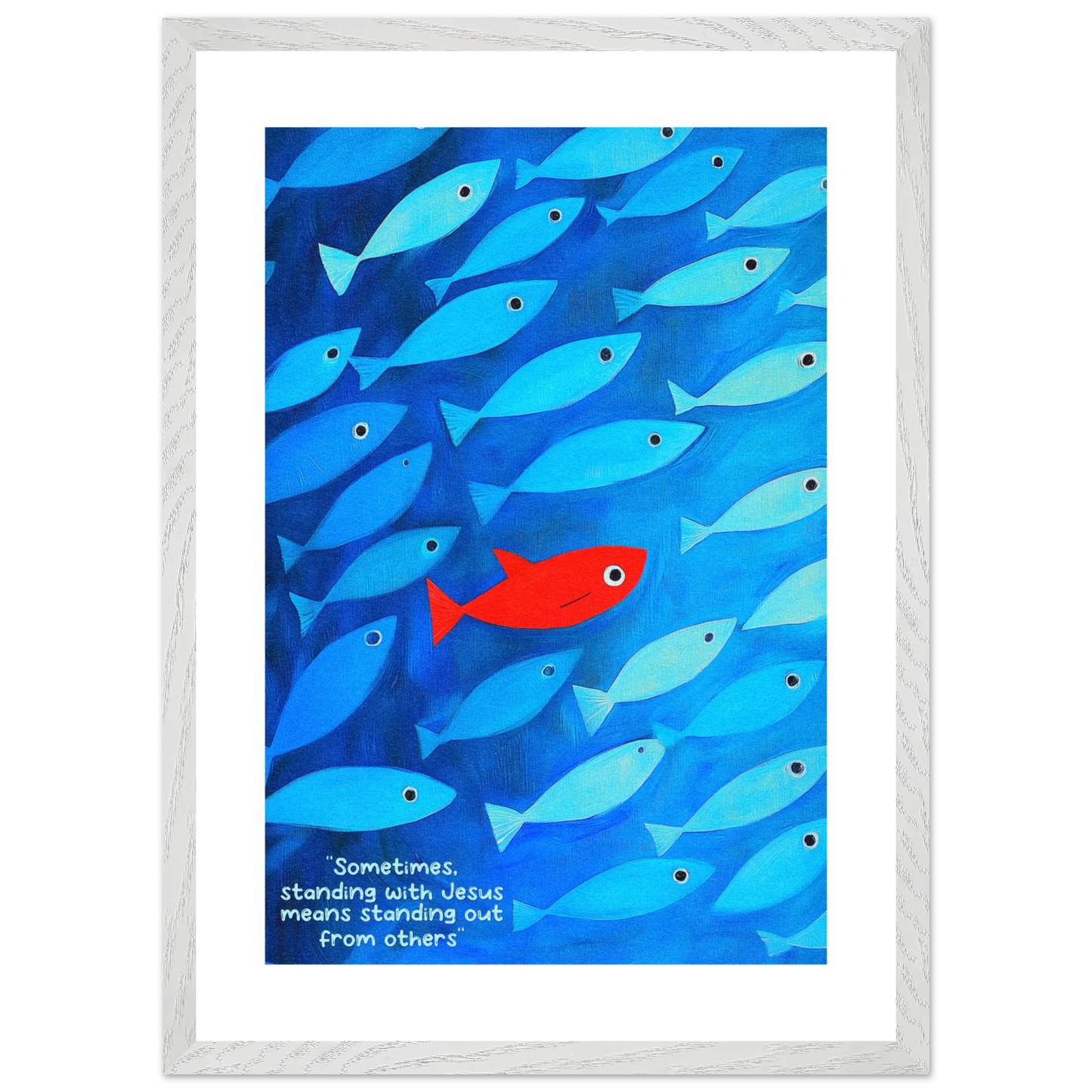 Framed wall art featuring a school of blue fish with a single red fish, and text that reads: 'Sometimes standing with Jesus means standing out from others.'.