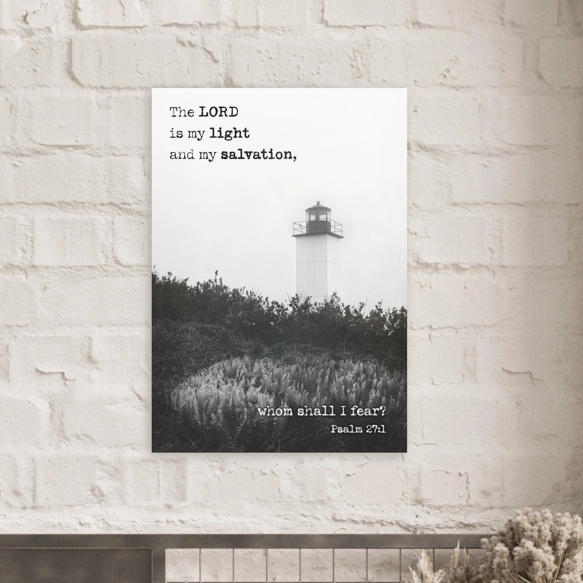 Poster with lighthouse and inspirational quote on a brick wall
