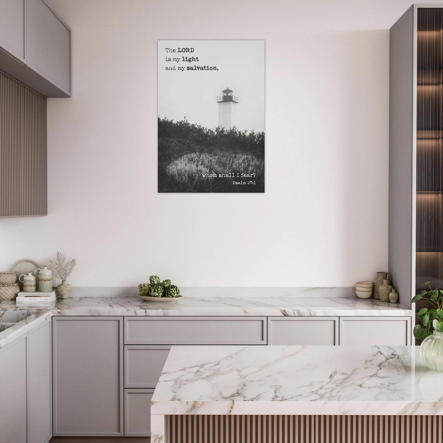 Modern kitchen with marble countertops and a framed picture on the wall.