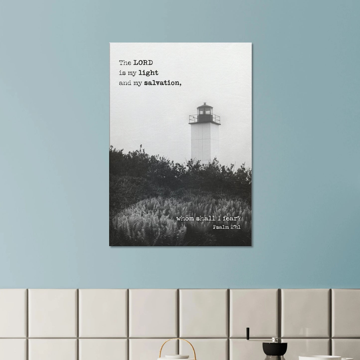 Psalm 27:1 lighthouse Christian wall art mounted on a blue wall above a modern tiled surface.