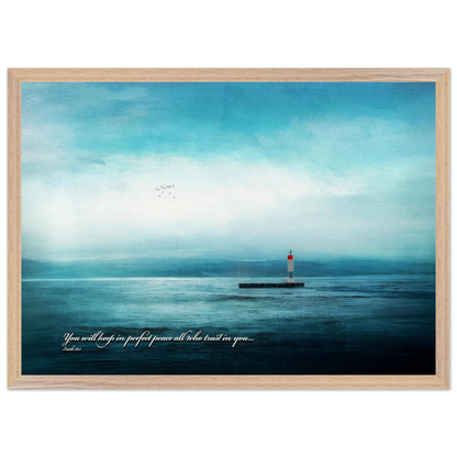 A framed poster featuring a lighthouse in a serene seascape with the text 'You will keep in perfect peace all who trust in you.' from Isaiah 26:3.