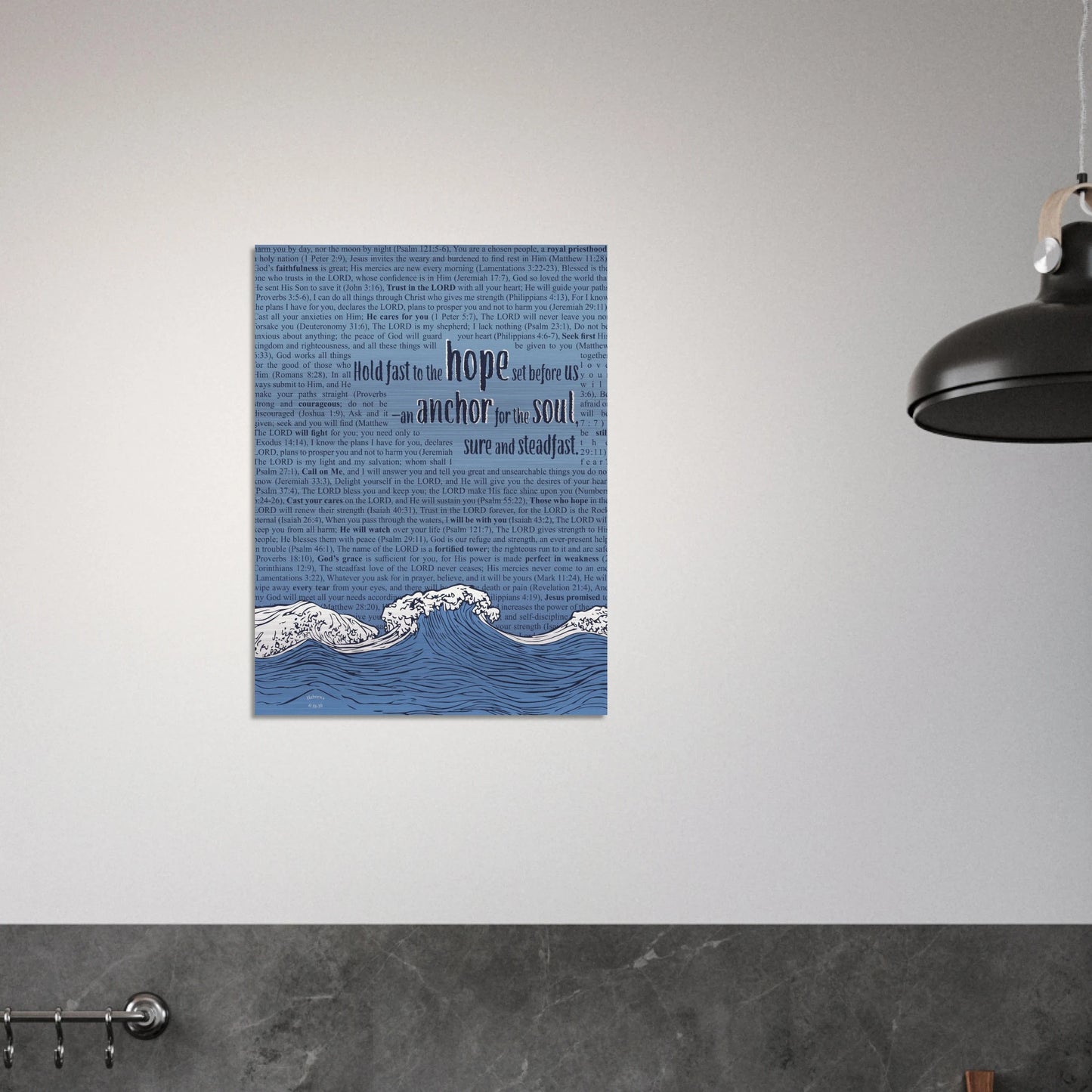 metal christian wall art with wave and anchor design and bible verses in pink and silver hanging on a minimalist industrial wall