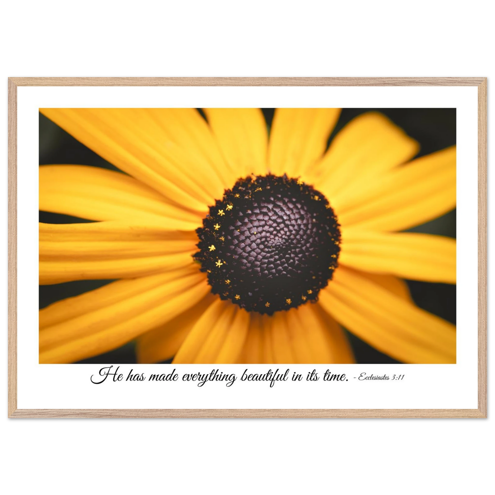 A framed art print of a close-up yellow flower with a quote from Ecclesiastes 3:11, 'He has made everything beautiful in its time.'.