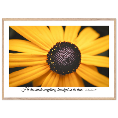 A framed art print of a close-up yellow flower with a quote from Ecclesiastes 3:11, 'He has made everything beautiful in its time.'.