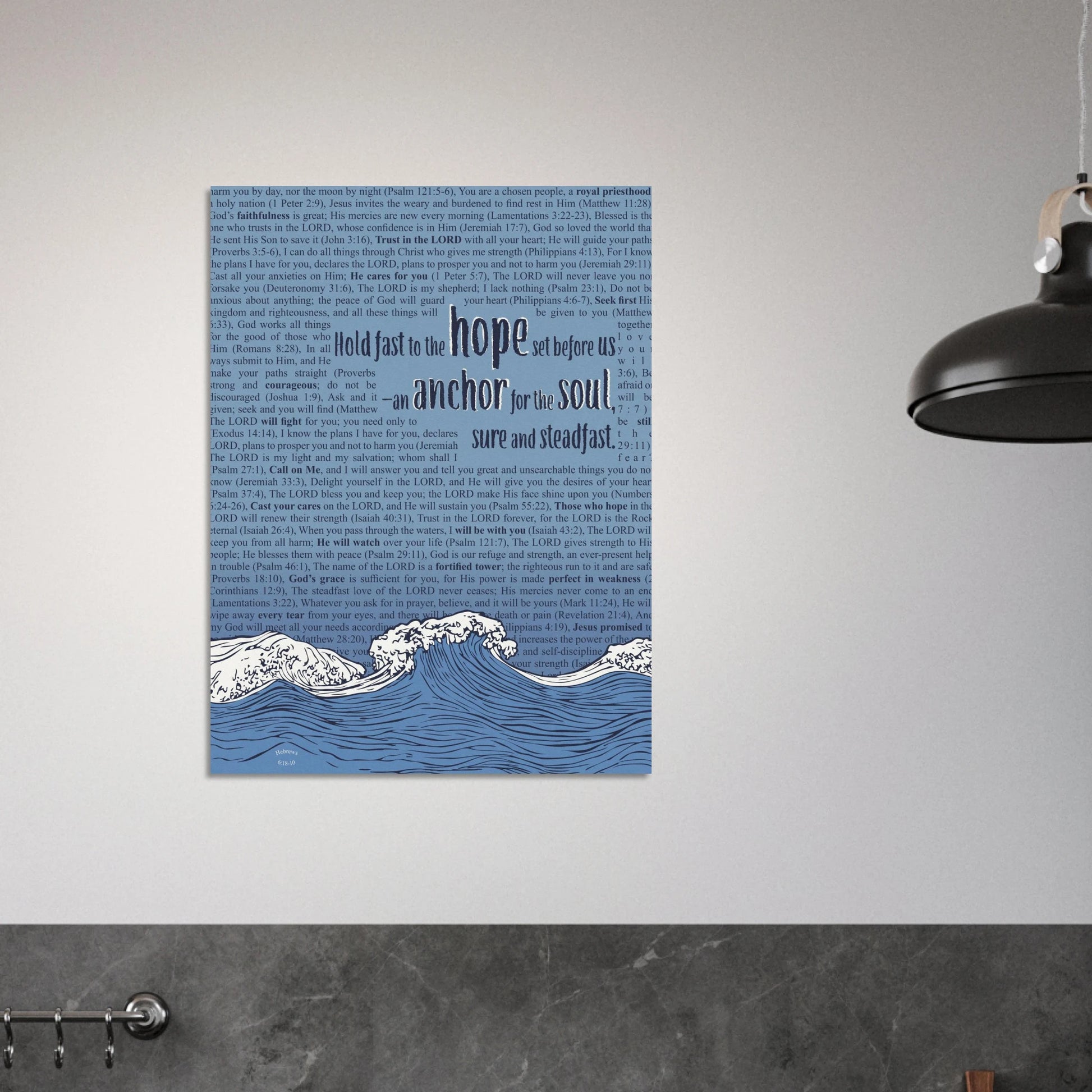 Christian canvas print with blue waves and Hebrews 6:19 hanging on a modern grey wall