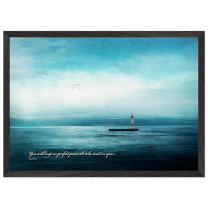 A framed poster featuring a lighthouse in a serene seascape with the text 'You will keep in perfect peace all who trust in you.' from Isaiah 26:3.