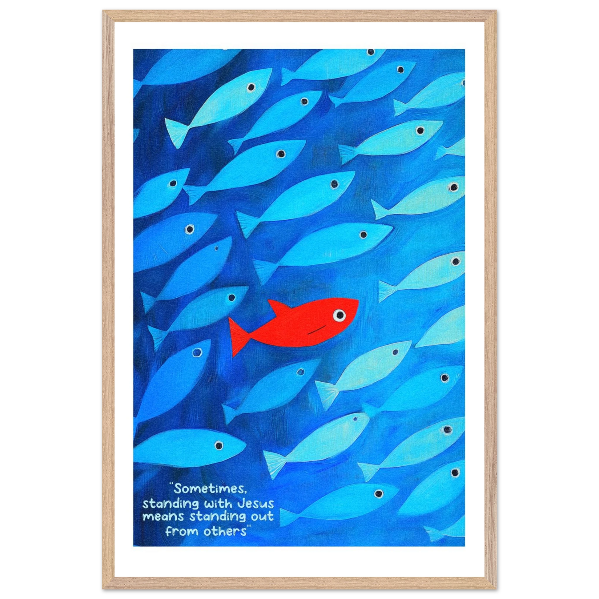 Framed wall art featuring a school of blue fish with a single red fish, and text that reads: 'Sometimes standing with Jesus means standing out from others.'.