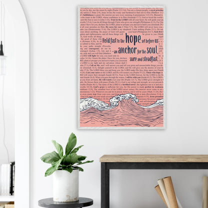 pink framed christian artwork with waves and anchor and scripture text displayed in a bright minimalist home office