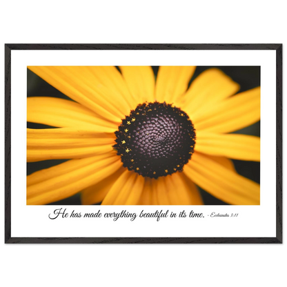 A framed art print of a close-up yellow flower with a quote from Ecclesiastes 3:11, 'He has made everything beautiful in its time.'.