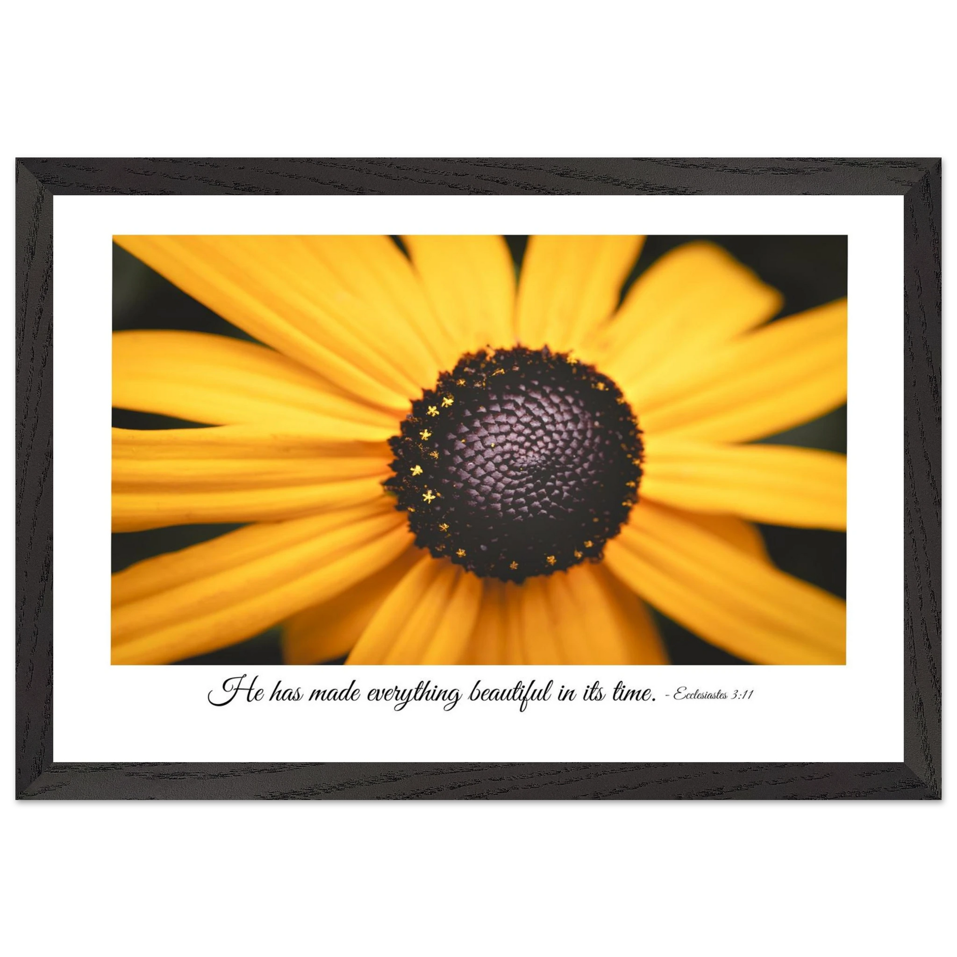 A framed art print of a close-up yellow flower with a quote from Ecclesiastes 3:11, 'He has made everything beautiful in its time.'.