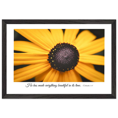 A framed art print of a close-up yellow flower with a quote from Ecclesiastes 3:11, 'He has made everything beautiful in its time.'.