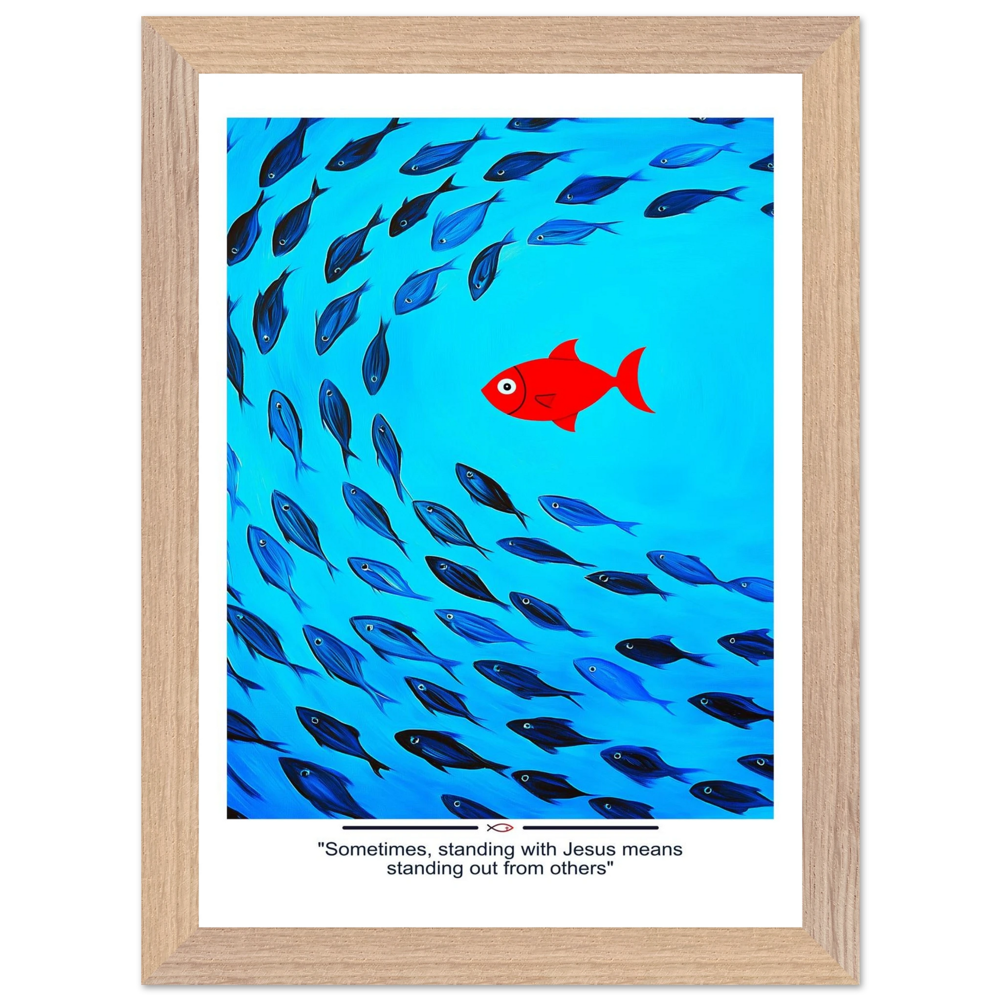 Framed Christian wall art featuring a red fish swimming in water with blue fish, and the text 'Sometimes standing with Jesus means standing out from others' as a quote.