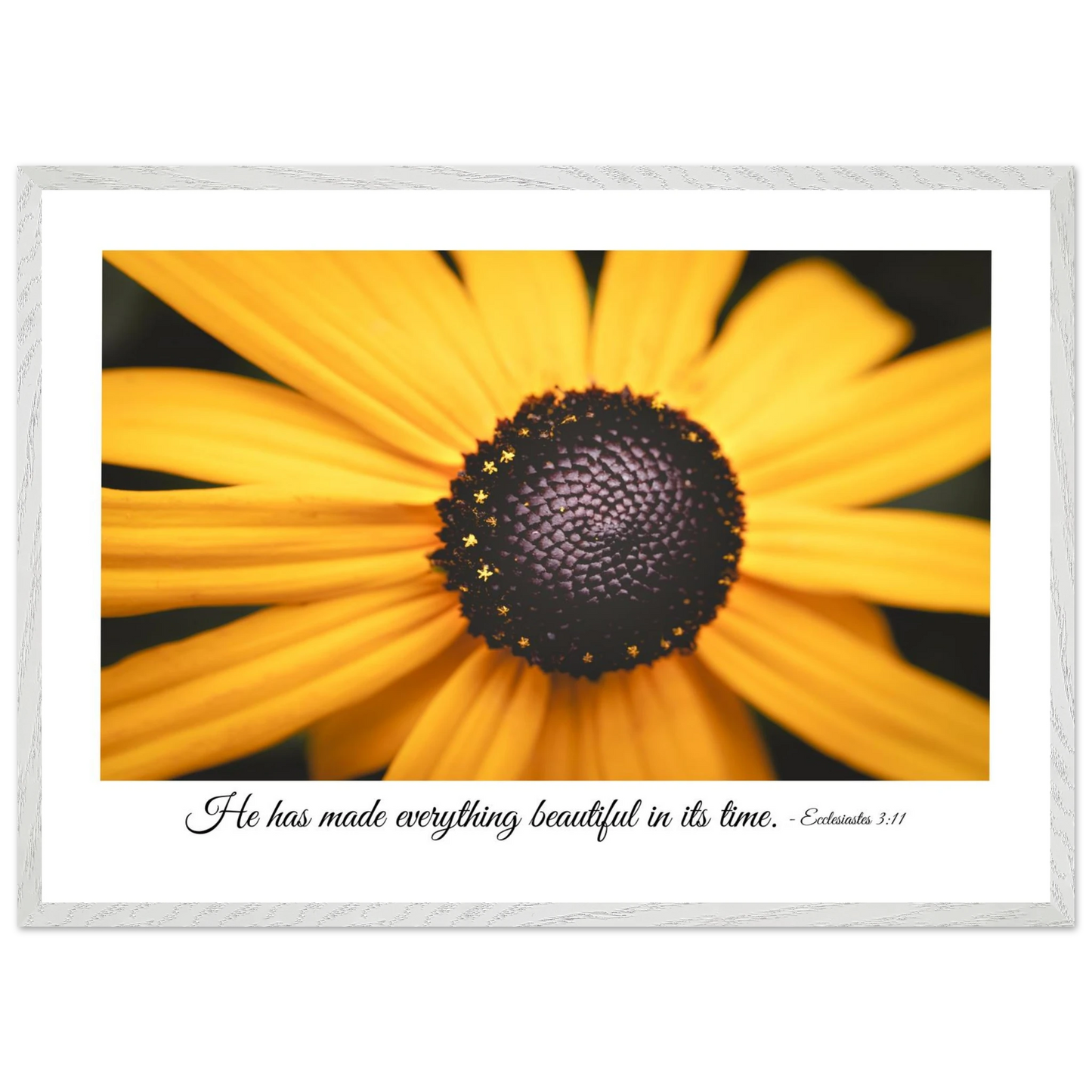 A framed art print of a close-up yellow flower with a quote from Ecclesiastes 3:11, 'He has made everything beautiful in its time.'.