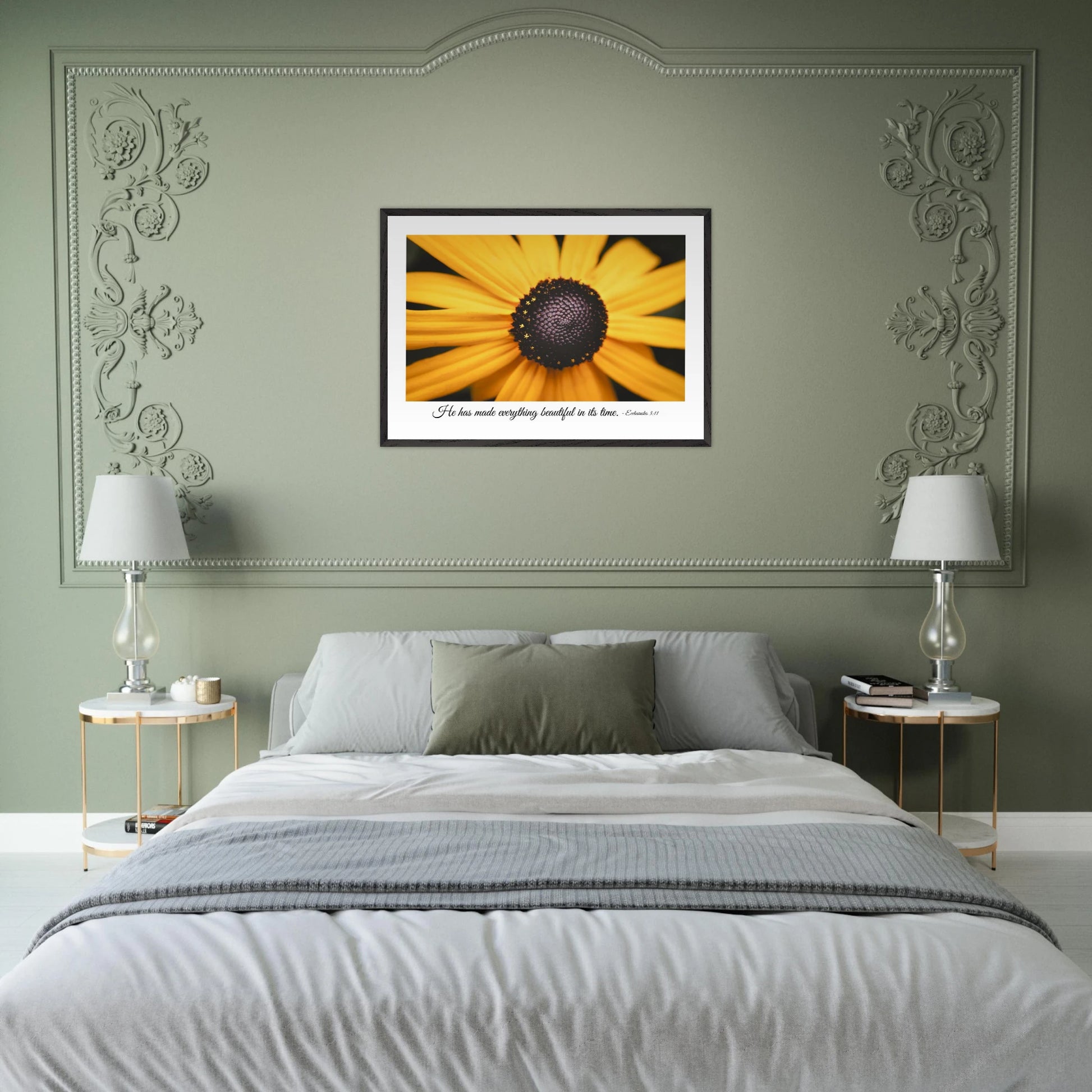 A framed art print of a close-up yellow flower with a quote from Ecclesiastes 3:11, 'He has made everything beautiful in its time.' displayed in a green wall bedroom