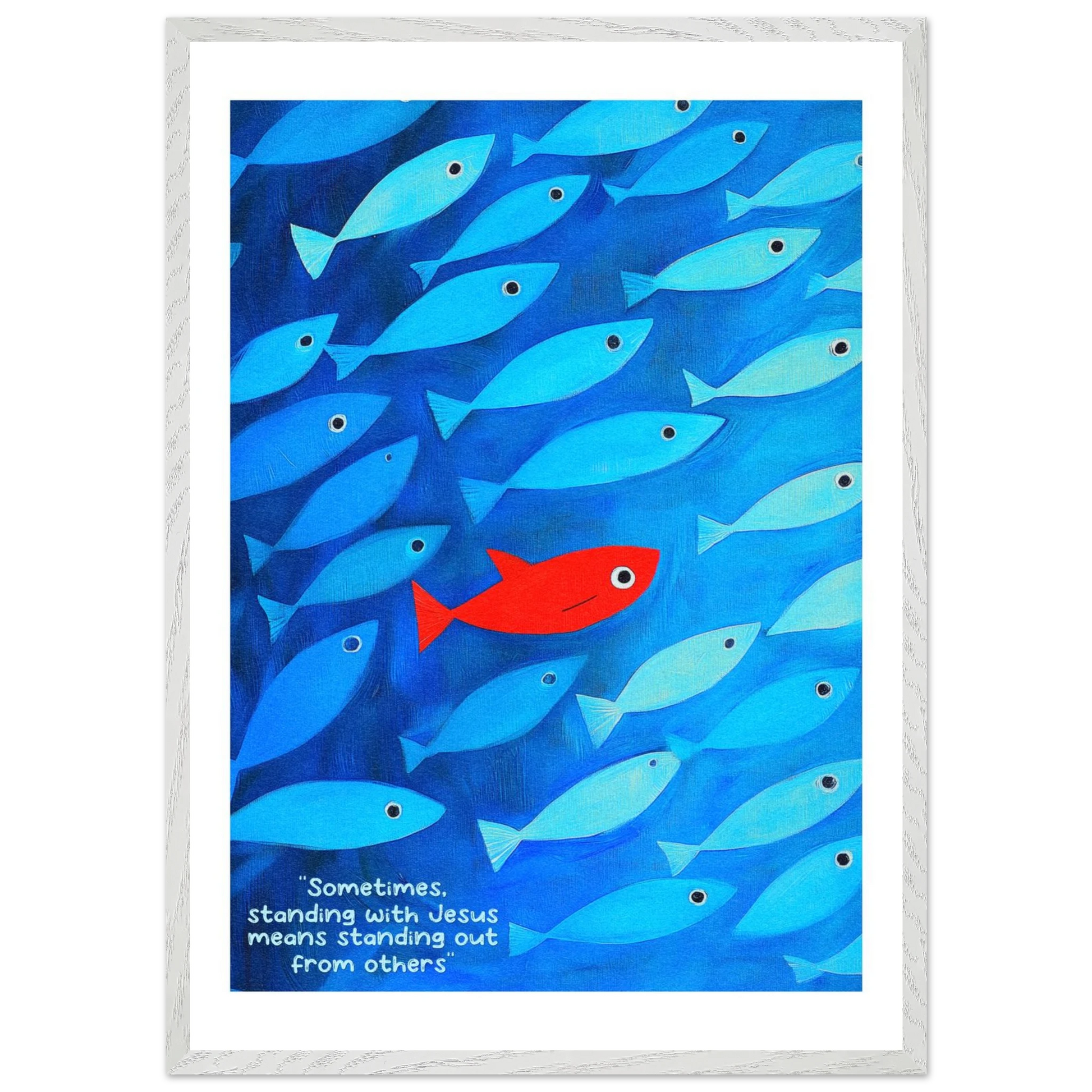 Framed wall art featuring a school of blue fish with a single red fish, and text that reads: 'Sometimes standing with Jesus means standing out from others.'.