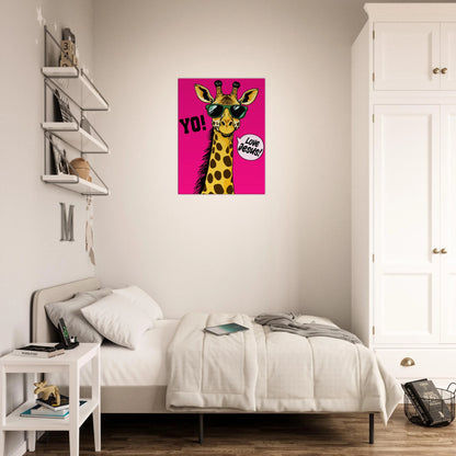A vibrant pink poster featuring a cartoon giraffe with sunglasses and a speech bubble with the phrase 'Love Jesus!' The giraffe is the central figure against a vivid pink background displayed in a bright minimalist bedroom