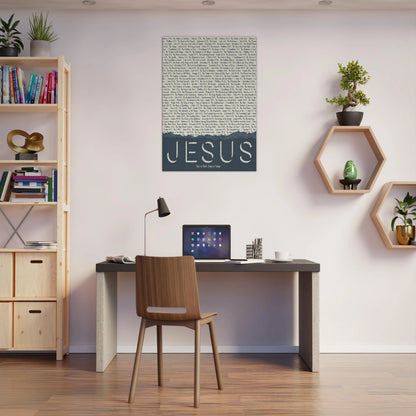 Modern home office with a desk, chair, and wall art featuring the word 'Jesus'.