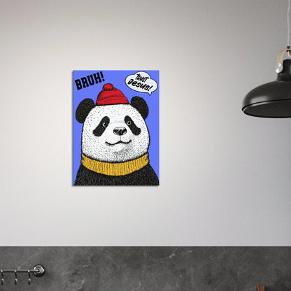 A canvas wall art featuring a cartoon illustration of a panda with a red beanie hat, a yellow scarf, and a speech bubble saying 'Trust Jesus' with a blue background displayed in a bright minimalist black and white kitchen
