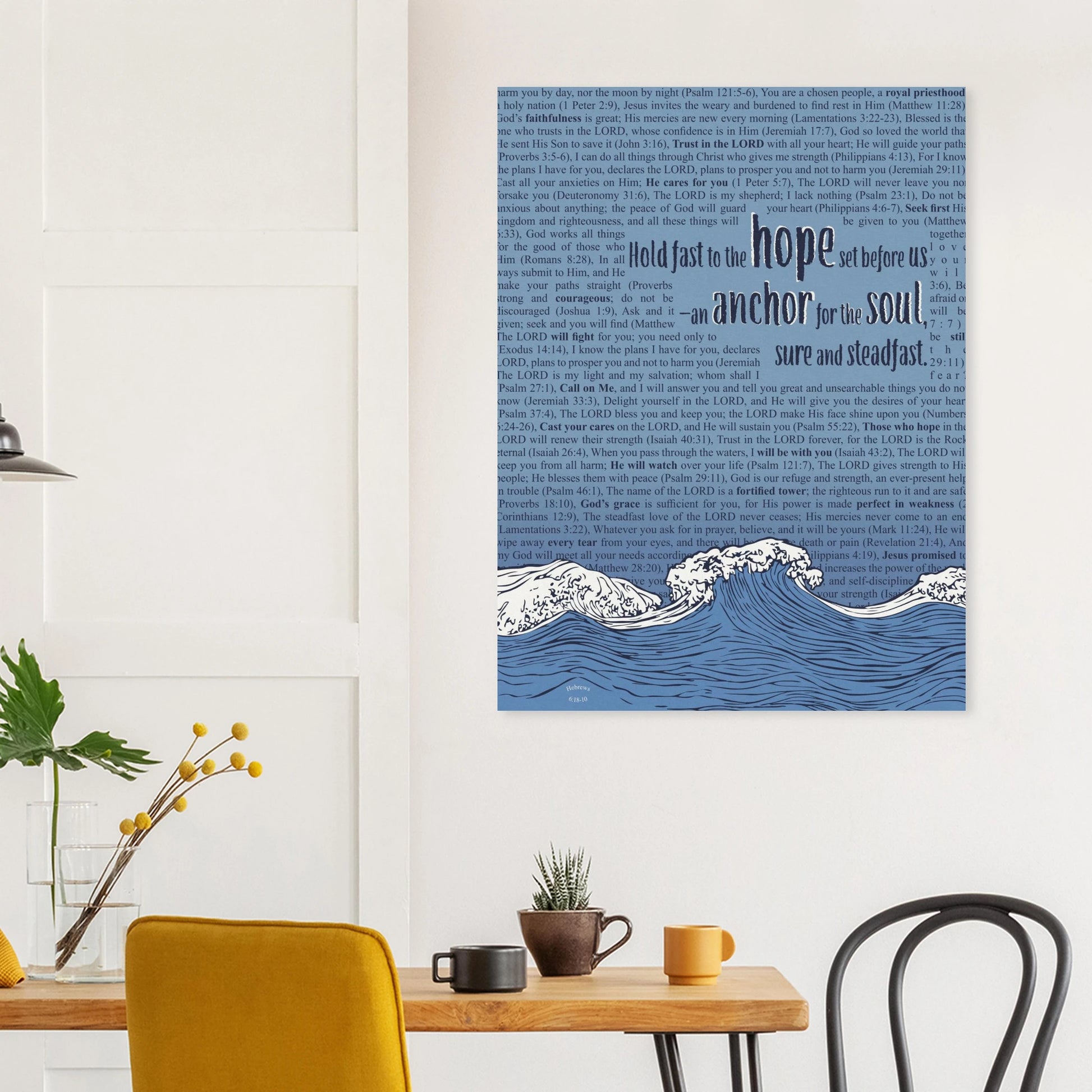 Canvas wall art with blue waves and Hebrews 6:19 displayed above a dining table with warm modern decor