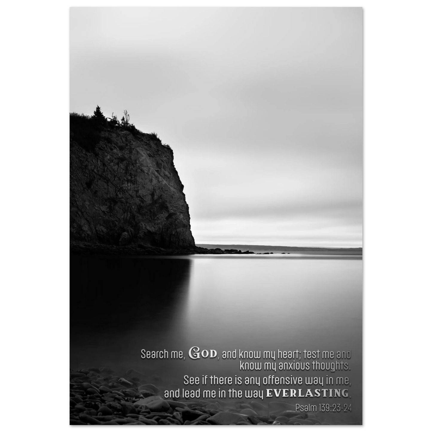 Black and white landscape with a cliff and water, featuring a religious quote.