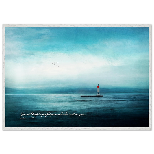 A framed poster featuring a lighthouse in a serene seascape with the text 'You will keep in perfect peace all who trust in you.' from Isaiah 26:3.