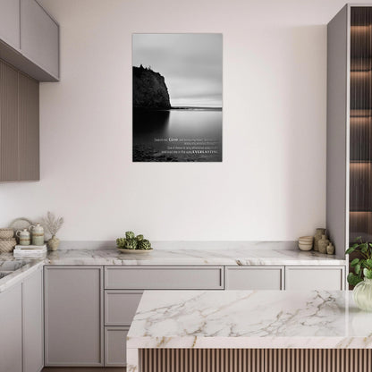 Modern kitchen with marble countertops and a scenic wall art print.