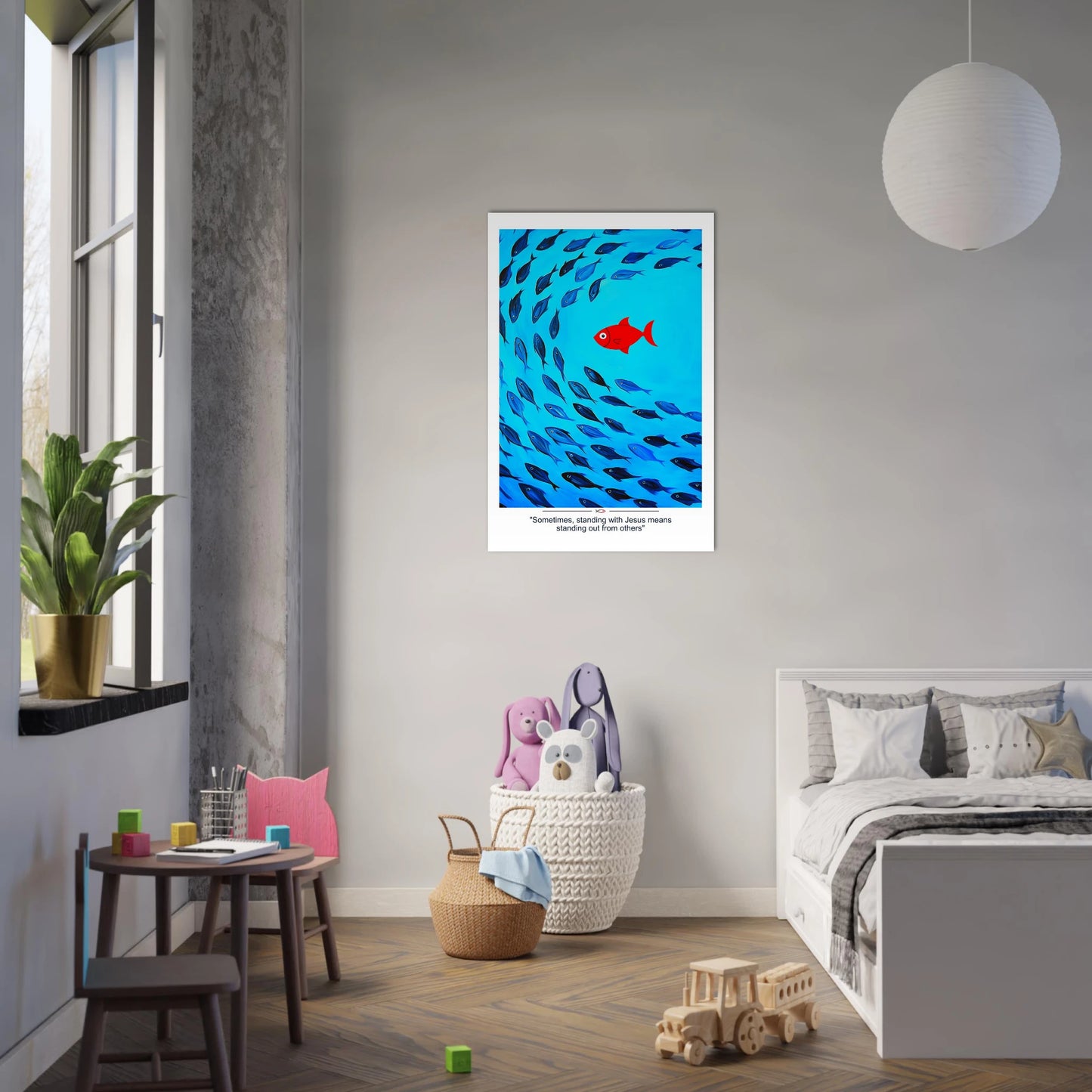 Christian wall art showing a red fish swimming against a school of blue fish with the message Sometimes standing with Jesus means standing out displayed in a minimalist and cozy kid bedroom